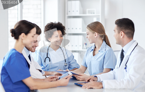 Image of group of happy doctors meeting at hospital office