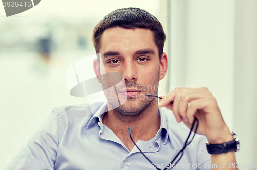 Image of portrait of businessman with eyeglasses at office