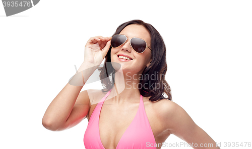 Image of happy woman in sunglasses and bikini swimsuit