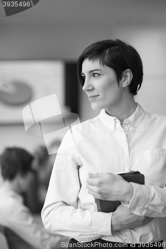 Image of business woman on meeting  using tablet computer