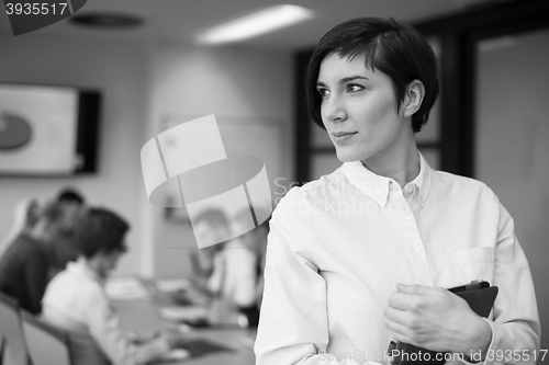 Image of business woman on meeting  using tablet computer