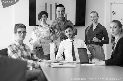 Image of startup business team on meeting at modern office with sunset in