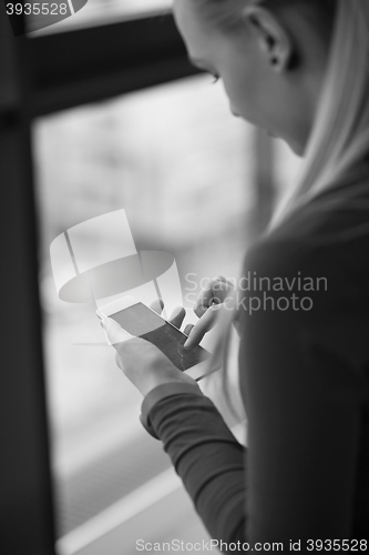 Image of business woman using smart phone at office