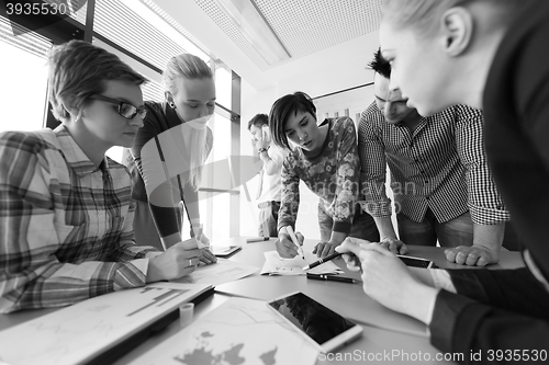 Image of startup business team on meeting at modern office with sunset in