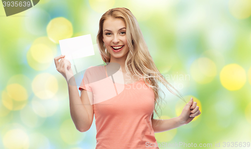 Image of happy woman or teen girl with blank white paper