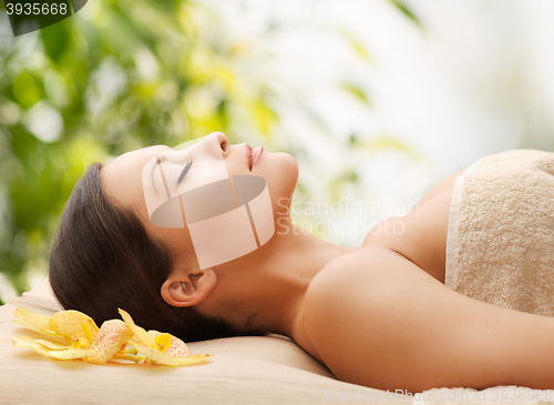 Image of woman in spa lying on the massage desk