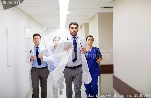 Image of group of medics walking along hospital