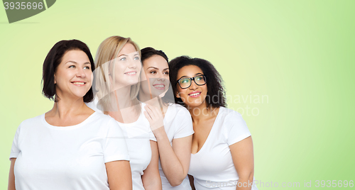 Image of group of happy different women in white t-shirts