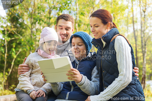 Image of happy family with tablet pc at camp