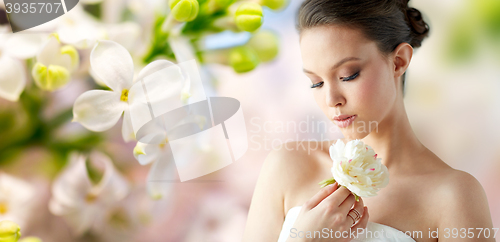 Image of beautiful asian woman with flower and jewelry