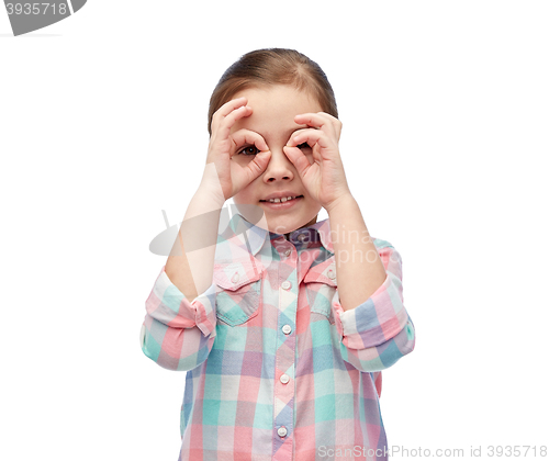 Image of happy little girl making faces and having fun