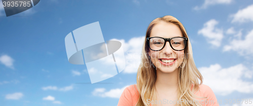 Image of happy young woman or teenage girl in eyeglasses