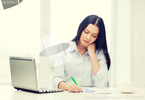 Image of tired businesswoman or student with laptop