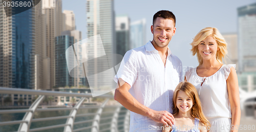 Image of happy family over dubai city street background