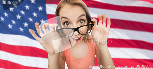 Image of happy young woman or teenage girl in eyeglasses