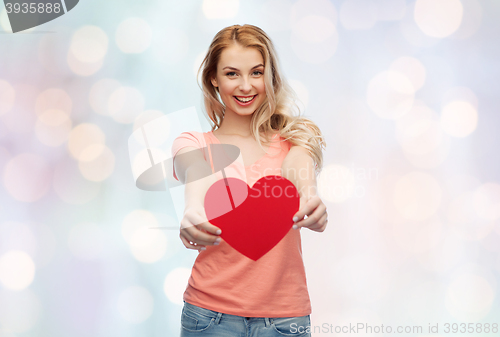 Image of happy woman or teen girl with red heart shape