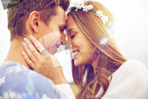 Image of happy smiling young hippie couple outdoors