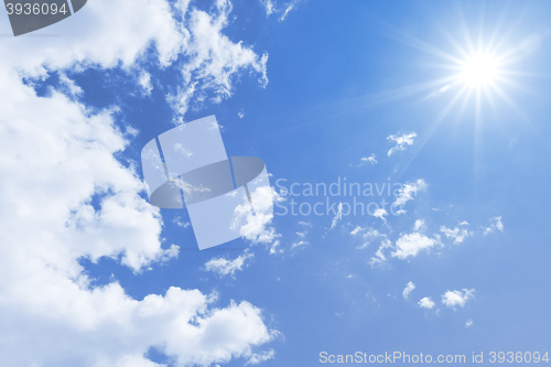 Image of blue sky sun and clouds background