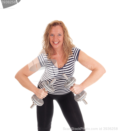 Image of Middle age woman workout with dumbbells.