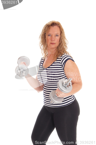 Image of Woman workout with dumbbells.