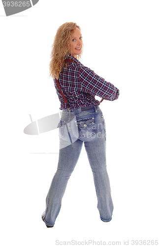 Image of Middle age woman standing from back.