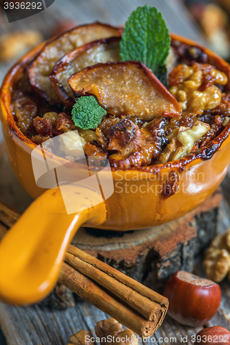 Image of Oatmeal with apples, cinnamon and nuts closeup.