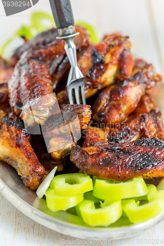 Image of Delicious chicken wings in a sweet glaze.