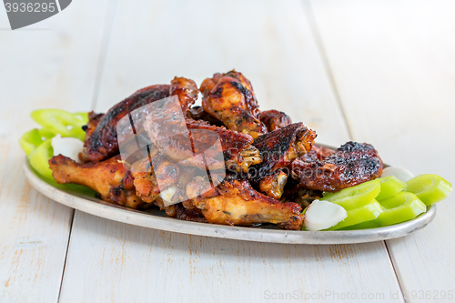 Image of Baked chicken wings with honey and ginger.