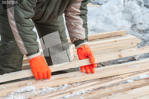 Image of Carpenter working at sawmill 