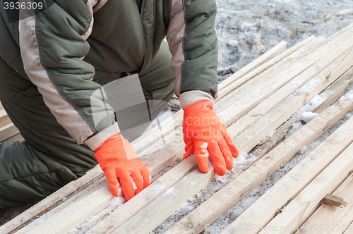 Image of Carpenter working at sawmill 