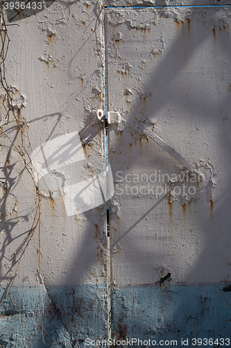 Image of Rust rusty corroded oxidize colorful door used metal sheet plate pattern wallpaper crack grunge abstract aged background iron artistic wall flaking peeling paint