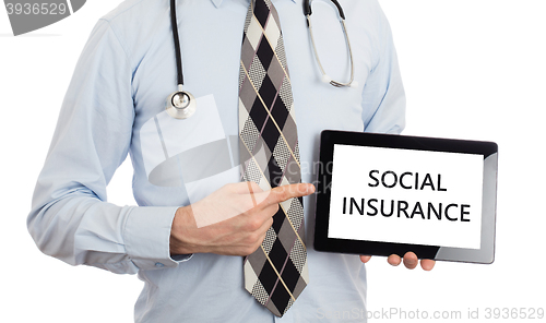 Image of Doctor holding tablet - Social insurance