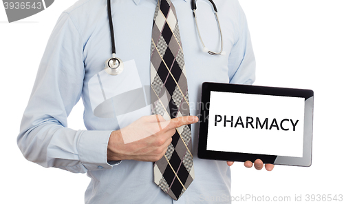 Image of Doctor holding tablet - Pharmacy