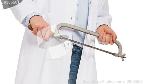 Image of Crazy doctor is holding a big saw in his hands