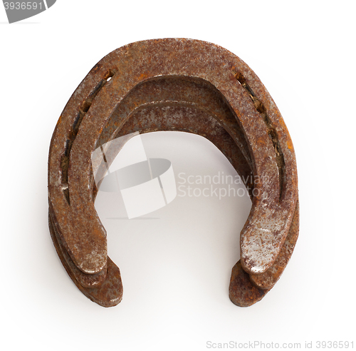 Image of Stack of old rusty horseshoes