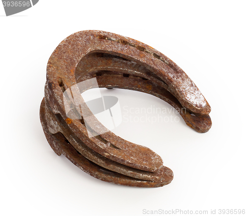 Image of Stack of old rusty horseshoes