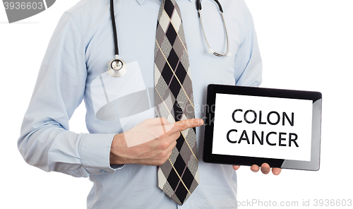Image of Doctor holding tablet - Colon cancer