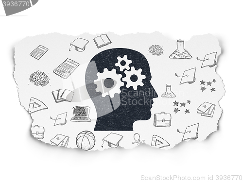 Image of Education concept: Head With Gears on Torn Paper background