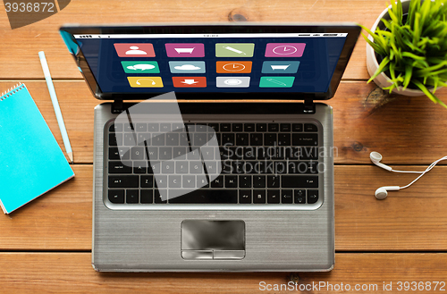 Image of close up of laptop computer with menu icons