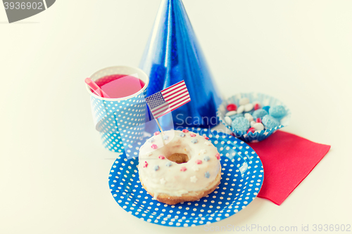 Image of donut with juice and candies on independence day