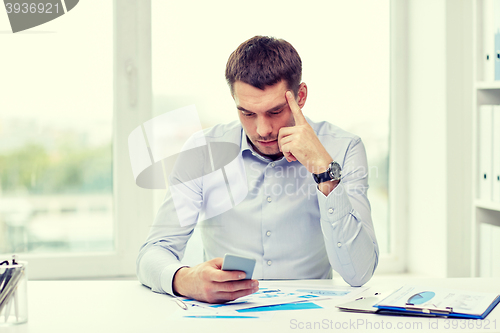 Image of close up of businessman with smartphone