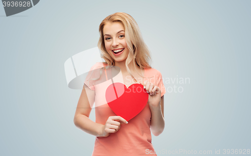 Image of happy woman or teen girl with red heart shape