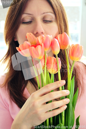 Image of Mature woman with flowers