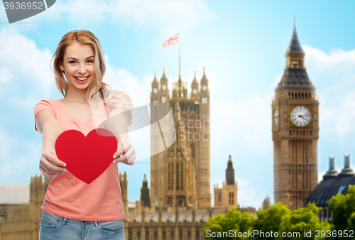 Image of happy woman or teen girl with red heart shape