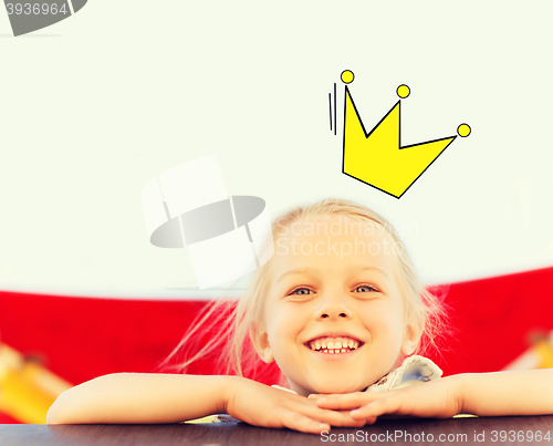 Image of happy little girl climbing on children playground