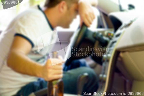 Image of Drunk man sleeping in the car