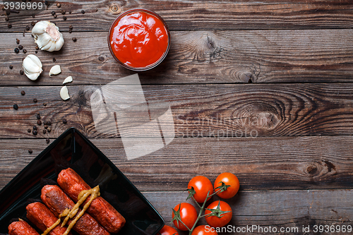 Image of Sausage roasted on the grill.