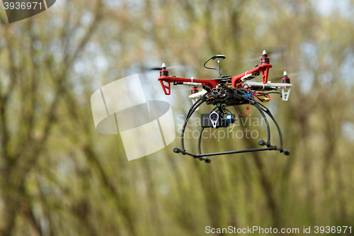 Image of Quadrocopter while flying in the forest. 