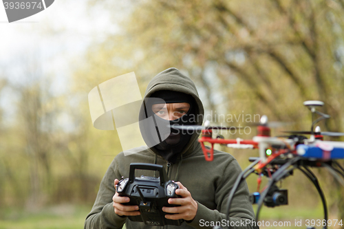 Image of Man flying with the drone