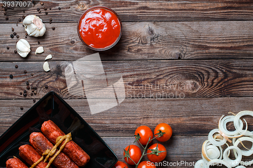 Image of Sausage roasted on the grill.